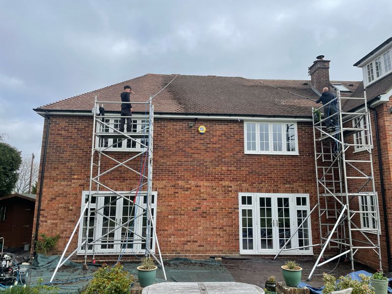 Roof cleaning carried out safely from scaffold towers by The Roof Moss Cleaners in Thornbury